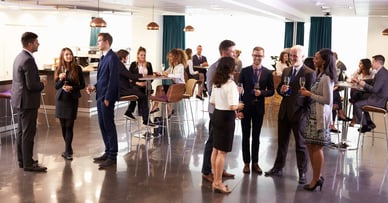 Executives at a networking event - Forbes Councils
