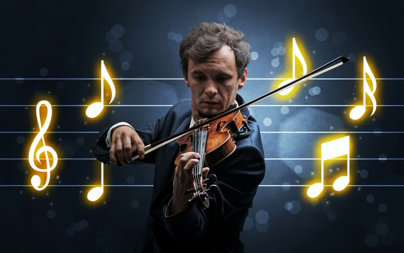 Violinist playing with glowing musical notes
