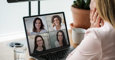 woman hosting a video conference on a laptop