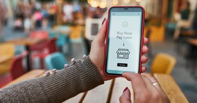 The Surge of Buy Now, Pay Later: The New Age of Consumer Financing - Phone Screen with Buy Now Pay Later App